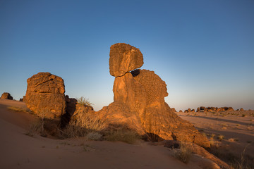 Fototapeta na wymiar Exceptional rock formation embedded in a large dune area – The Fingers, Es Sba, Mauritania