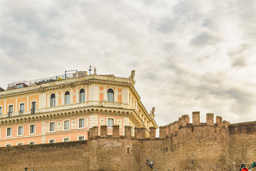 Fototapeta na wymiar Battlement and Buildings, Rome, Italy