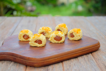 Closeup of a pineapple tart outdoors in a garden