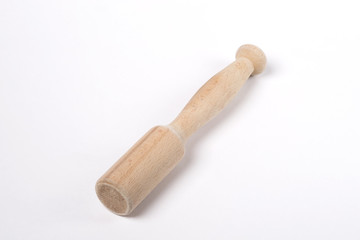 Beater for meat on a white background. The Tolkushka. Kitchen
