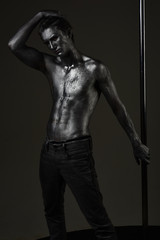 Fototapeta na wymiar Macho with naked chest, athlete, sportsman hold metallic pole.