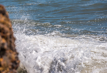 Amazing sea with blue summer wave and rocks, relaxing view of rocks and water