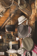 Old hats hanging from a beam