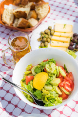 Summer salad with olives, tomatoes and cheese