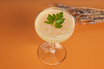 Petrucho cocktail drink on bar table in restaurant. Freshness drink with Parsley Infused, Cacao white, Lawanda bitter, Lemon juice, Simple syrup Parsley
