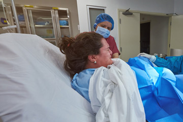Young woman give childbirth