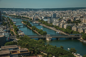 Skyline, River Seine bridges and buildings under blue sky, seen from the Eiffel Tower in Paris....