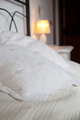 Fototapeta na wymiar pillows on bed - bright bedroom interior design
