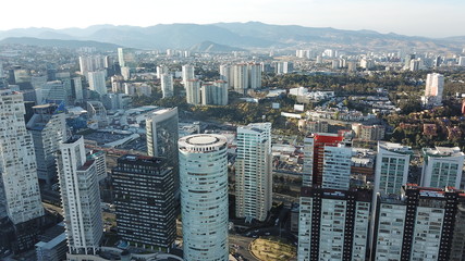 Aerial view of Santa Fe Mexico buildings and skyscrapers with mountain as background 