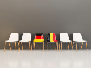 Chairs with flag of Germany and belgium in a row