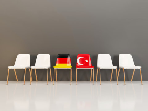 Chairs with flag of Germany and turkey in a row
