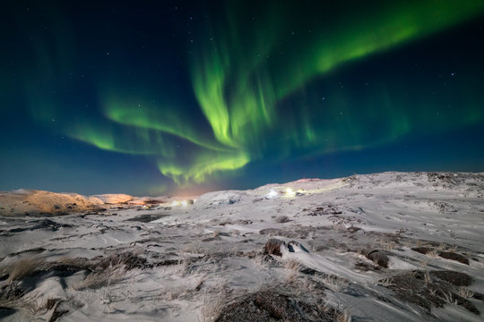 Northern Lights on the shore of the Arctic Ocean.