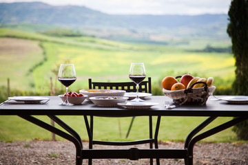 Fototapety  lunch with a view - table against beautiful landscape in Tuscany