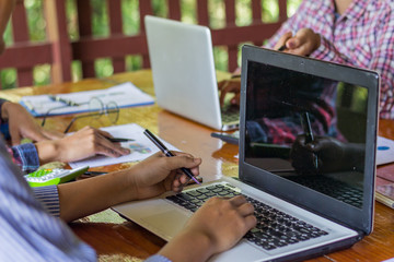 Businessmen meeting and explain the business results of the month.