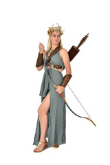 full length portrait of pretty blonde lady wearing fantasy toga gown,  and holding a bow and arrow....