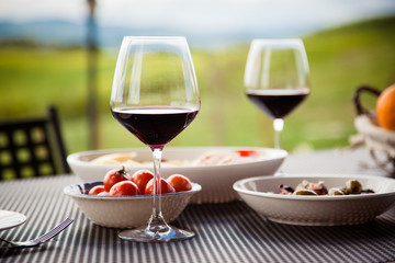 lunch with a view - table against beautiful landscape in Tuscany