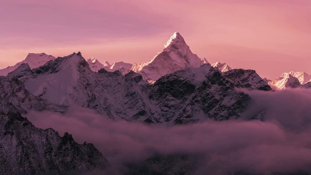 Greatness of nature: grandiose view of Ama Dablam peak (6812 m) at sunset. Nepal, Himalayan mountains. Time lapse.