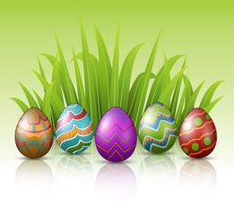 Decorated Easter eggs with green grass background