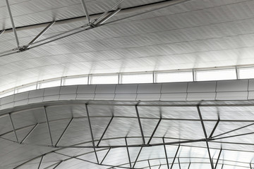 Steel roof truss work with fiber roof covering in an industrial area
