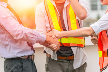 Engineer Constructor Teamwork Handshaking deal project together with business investor man good relationship concept.