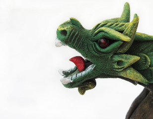 Fototapeta premium Figurine of a green dragon, open mouth