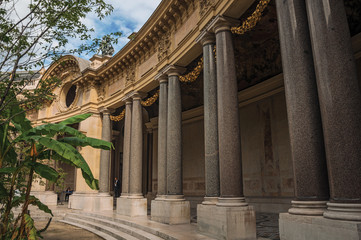 Close-up of the far-fetched decoration of arch and columns at the Petit Palais courtyard in Paris. Known as the “City of Light”, is one of the most impressive world’s cultural center. Northern France.