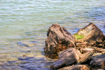 Chumphon beachfront Close to the scenic spot (Khao Matsee) with shady trees. There are fishing houses, small fishing boats. And the turquoise sea. It is a beautiful province in the south of Thailand.