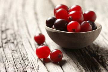 Cranberries close-up on old wood