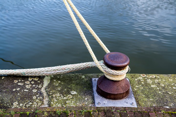 Marina bollard (bitt) to tie mooring ropes for yachts mooring