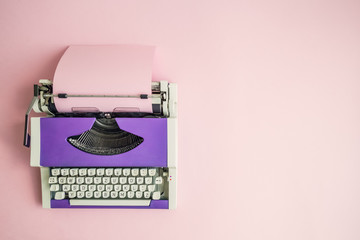 Flat lay of retro hipster typewriter pastel abstract concept.