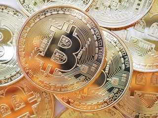 Golden Bitcoin on the circuit board or computer motherboard with the concept of technology and modern business on the currency of the future world.