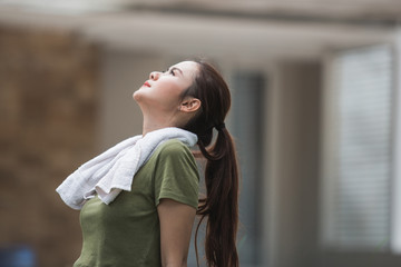 female take a break after exercising 