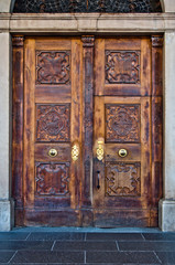 antique wooden door with handle and decorations