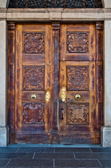 antique wooden door with handle and decorations