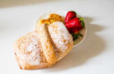 Bread with strawberries and cheese in the form of a heart