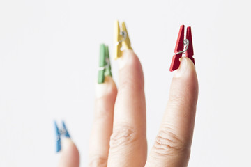 Mini pegs on fingers