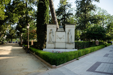 Spain, Seville, FOOTPATH AMIDST TREES AND BUILDING at Plaza de Espana