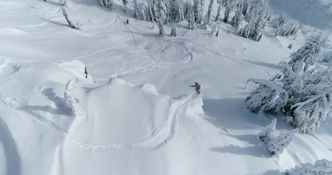 Snowboarder Drone Aerial Follow Off Jump
