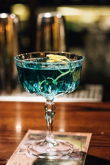Delicious alcohol cocktail on wooden table
