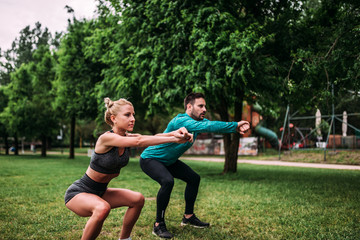 Doing squats outdoors. © bnenin