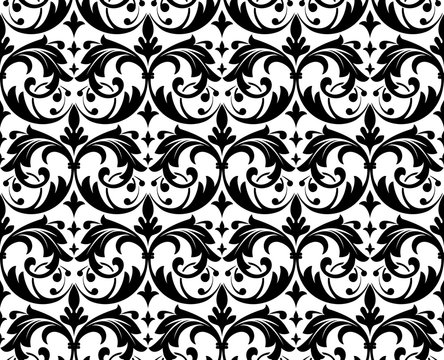 Wallpaper in the style of Baroque. A seamless vector background. White and black floral ornament. Graphic pattern for fabric, wallpaper, packaging. Ornate Damask flower ornament