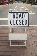 Road closed sign on a city road impassable for repairs