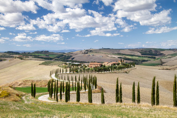 Val d'Orcia, October 2017: Tuscan landscape with hill, house and cypress, Siena, Tuscany, Italy