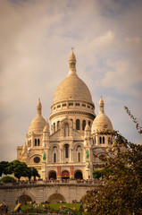 Fototapeta na wymiar The Famous Sacre Coeur Basilica Overhanging Paris from the Mound Montmartre