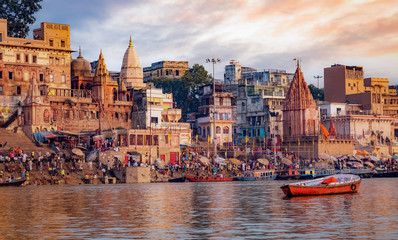 Varanasi ancient city architecture with view of Ganges river ghats at sunset. Varanasi is located in the state of Uttar Pradesh India.