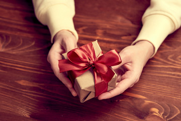 hands holding craft gift box