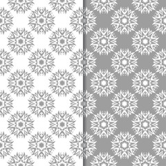 White and gray floral backgrounds. Set of seamless patterns