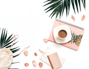 Flat lay blogger workspace mockup with tropical leaves , coffee and accessories on white background. Copy space