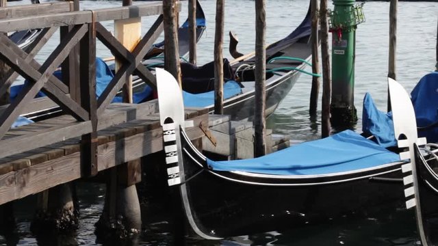 Traditional venice gondola boats in venice canals.