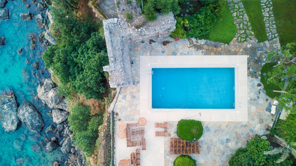 Aerial view at the pool and sea. Beautiful natural landscape at the summer time